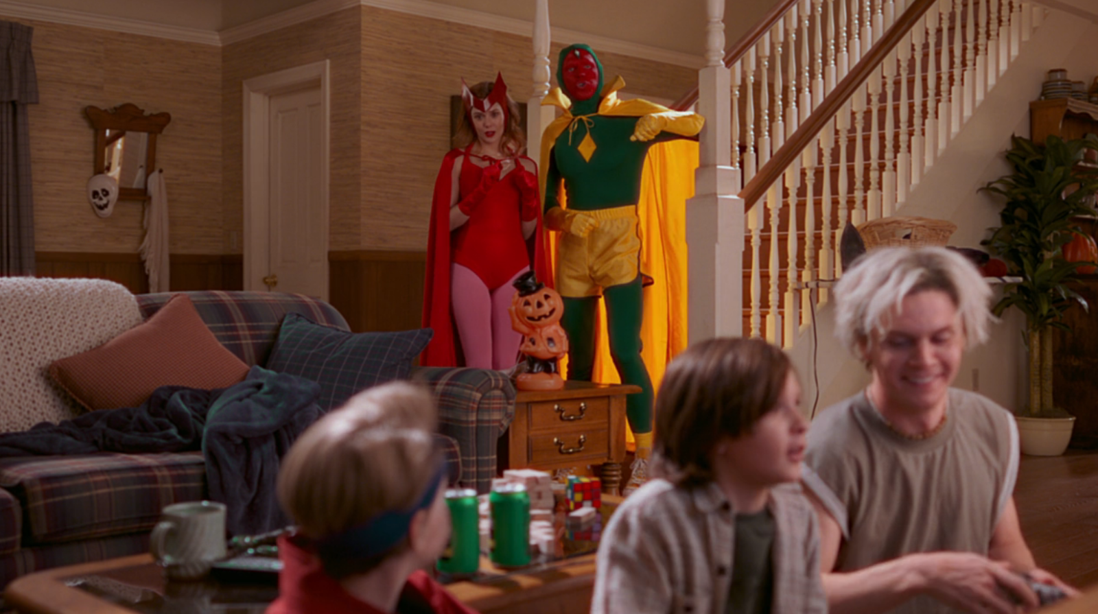 Wanda and Vision don comic book accurate costumes for Halloween in WandaVision episode 6.