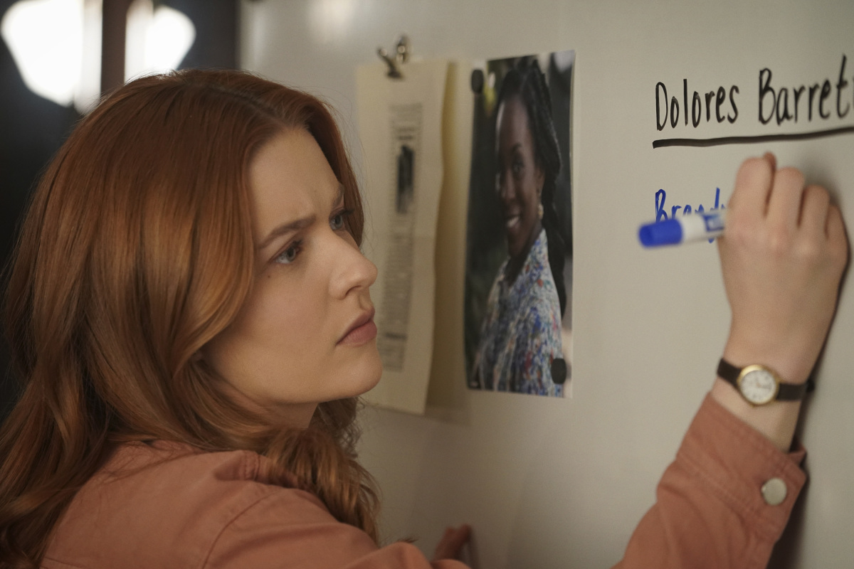 Nancy writing on Dolores board Nancy Drew