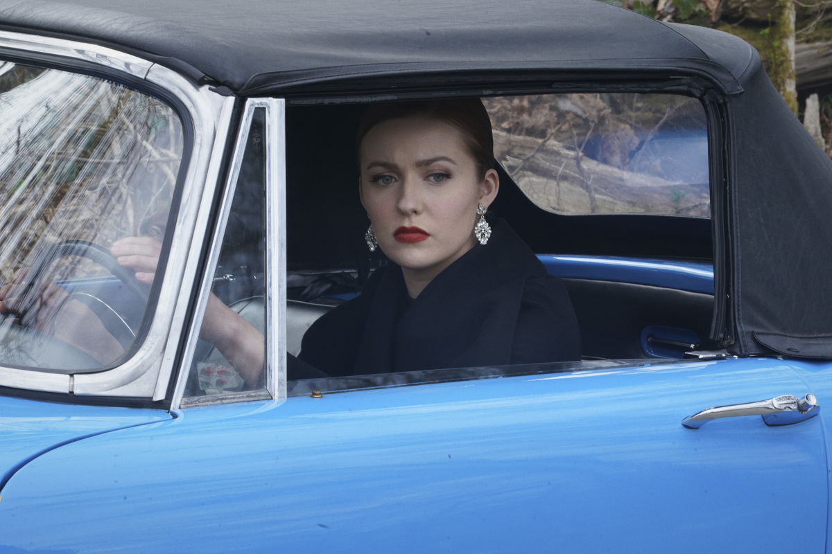 Nancy in her car on Nancy Drew